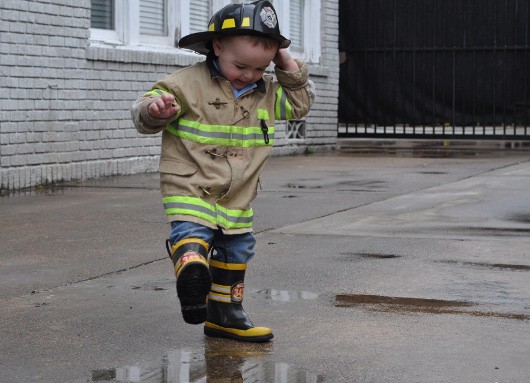 Baby Spashing in Rain Puddles