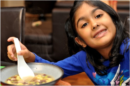 Pretty Girl Eating Leftover Turkey Soup