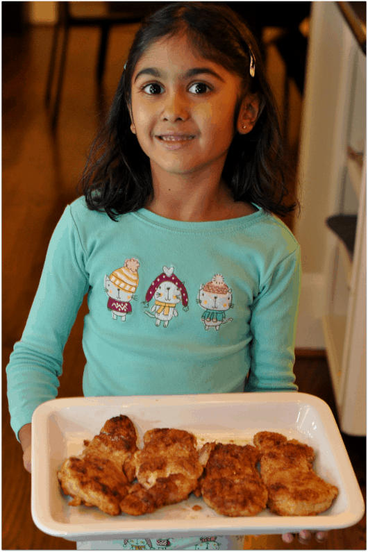 Pretty Girl Helping with Fried Chicken Dinner