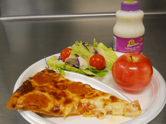 A student favorite – pizza – is now made at schools with whole-grain crust and low-fat cheese, and served with a garden salad, piece of fruit and fat-free milk.