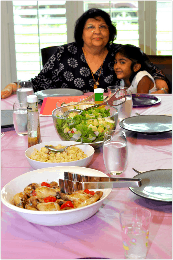 Family Dinner of Roasted Chicken with Tomatoes