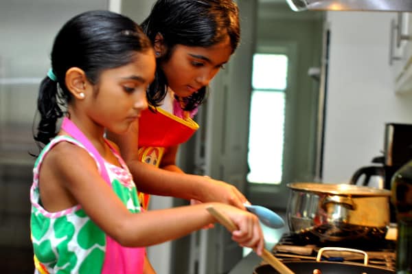 Girls Helping Mom Cook Dinner