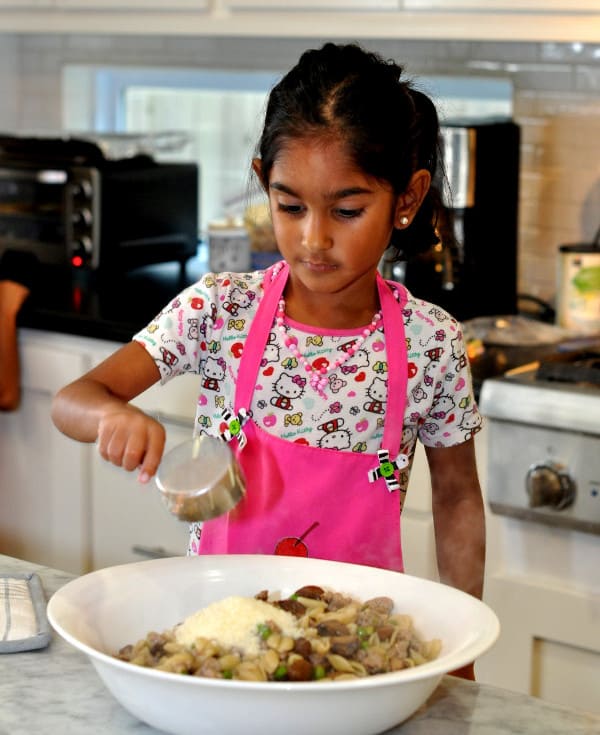 Making Cavateli with peas, mushrooms and sausage