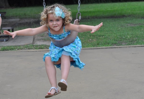 Crooked Smile on Swings at Grady Park Houston