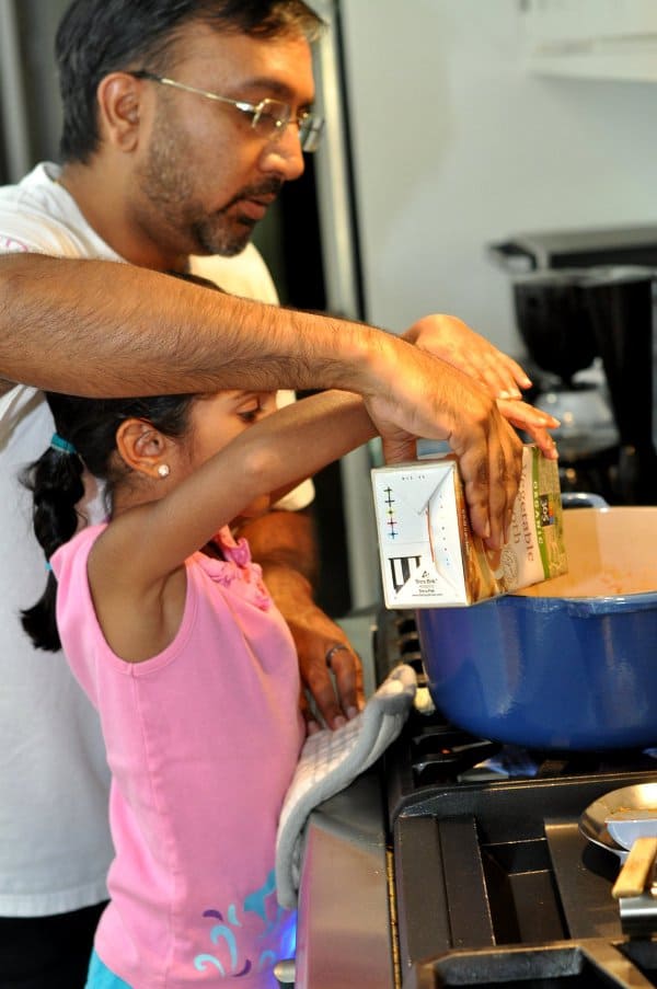 Adding broth to Summer Minestrone Soup