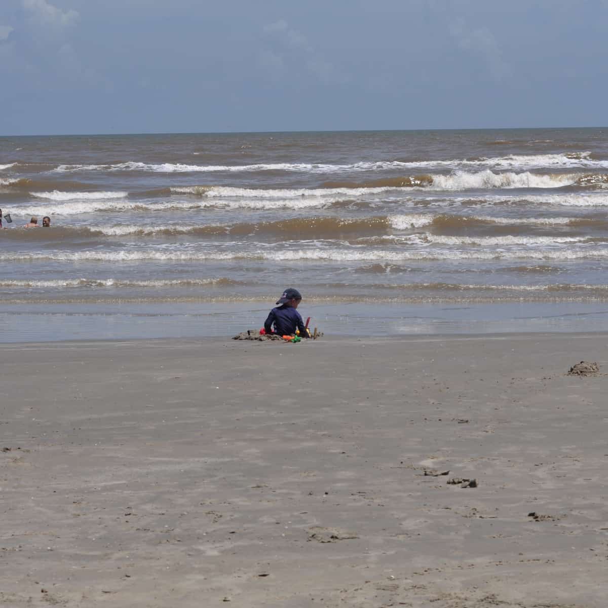 Playing in Sand at Jamaica Beach