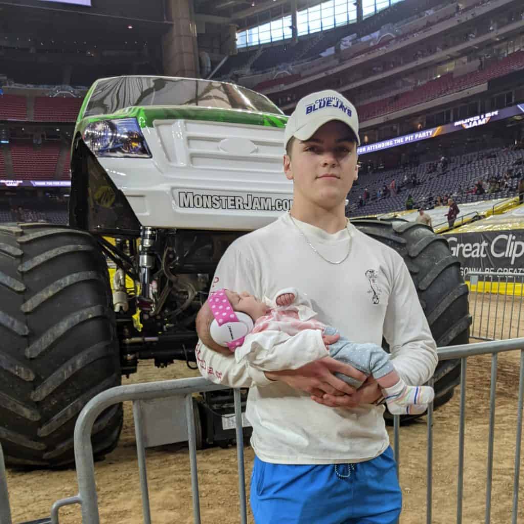 Standing in front of Monster Jam Monster Truck