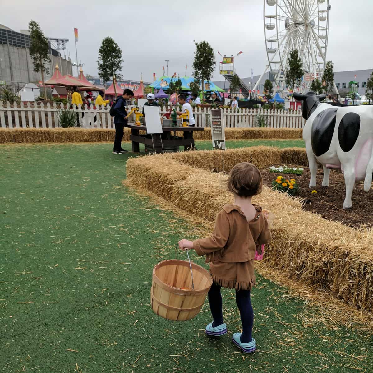 Girl Carrying Basket at Fun on the Farm Rodeo Houston