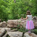 Walking on logs at Nature Discovery Center Houston
