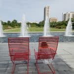 Hermann Park Centennial Garden Chair in from of fountain