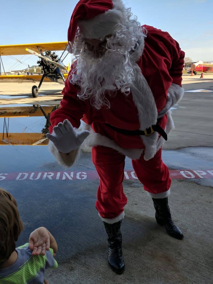 Santa flying in to the Lone Star Flight Museum