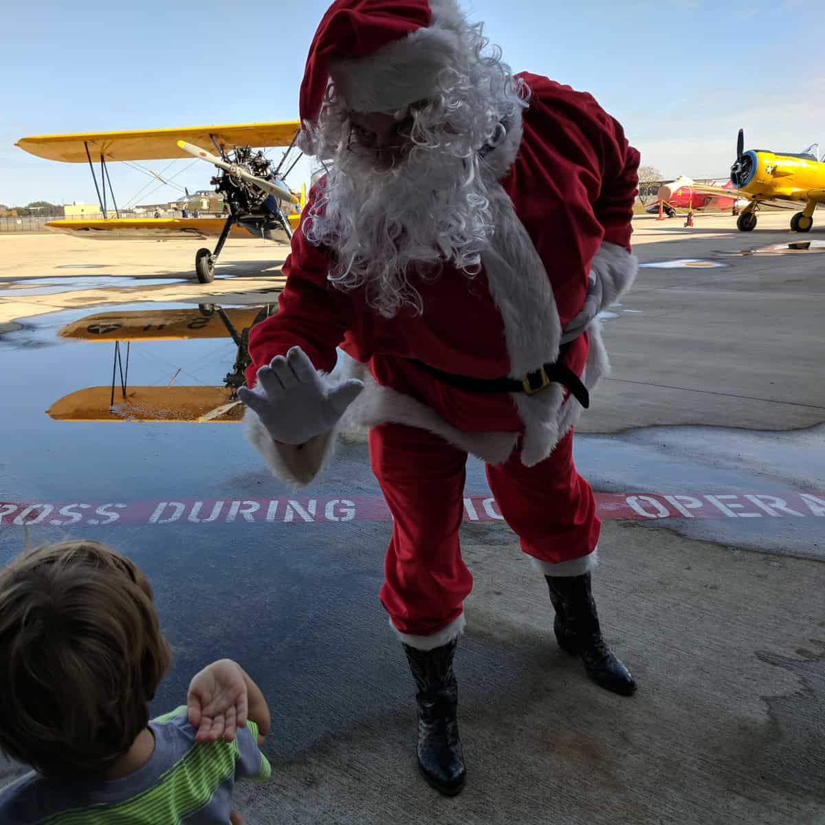 Santa flying in to the Lone Star Flight Museum