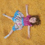 Kid at Fun on the Farm Corn Box at Rodeo Houston