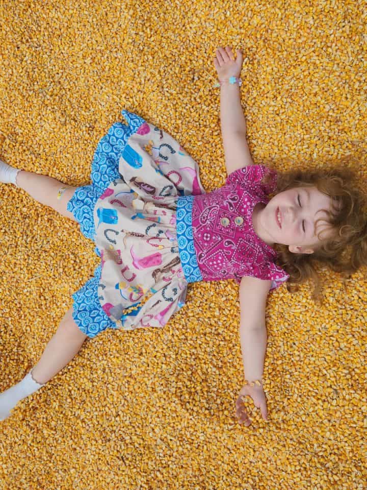 Kid at Fun on the Farm Corn Box at Rodeo Houston