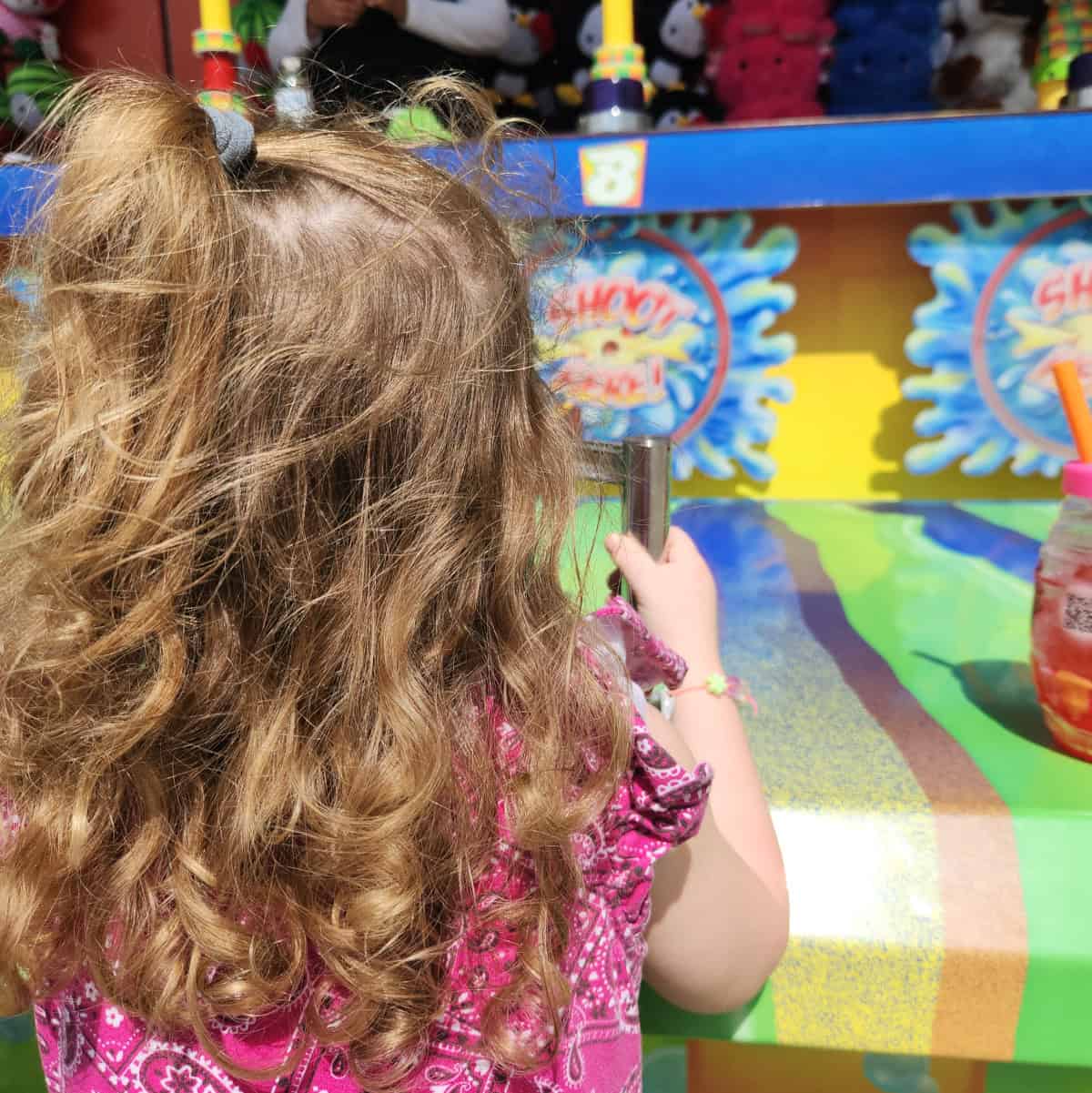 Playing games at Rodeo Houston Carnival